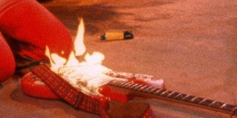 Jimi Hendrix burning his guitar at the Monterey Pop Festival in 1967